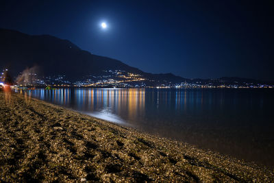 Scenic view of sea against sky at night