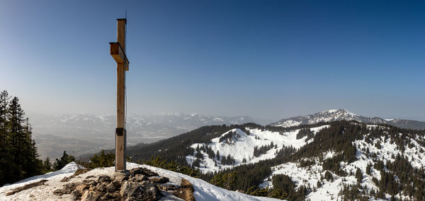 Scenic view of snowcapped mountains against clear sky