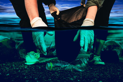 Low section of people relaxing in sea