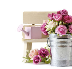 Close-up of roses in vase on table