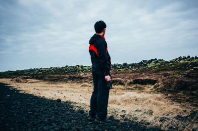 Full length of woman standing on landscape