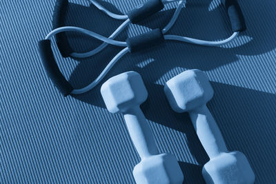 High angle view of dumbbells on table