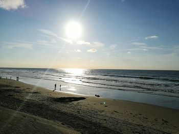 Scenic view of beach at sunset