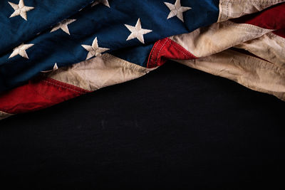 High angle view of flags over black background