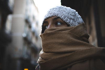 Portrait of beautiful woman with covered face