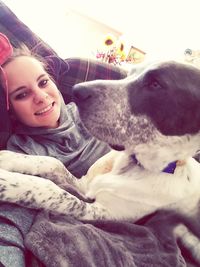 Portrait of young woman with dog