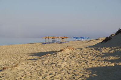 Scenic view of beach against clear sky