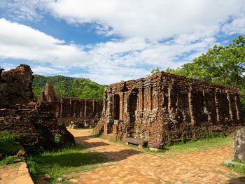 View of old ruin building against cloudy sky