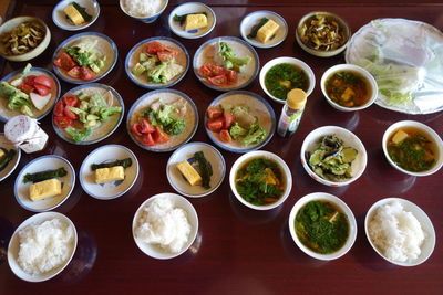 High angle view of various food served on table