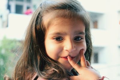 Close-up portrait of cute smiling girl