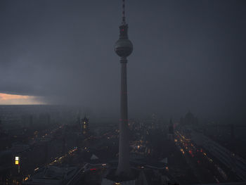 Aerial view of city lit up at night