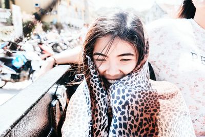 Close-up of happy woman standing outdoors