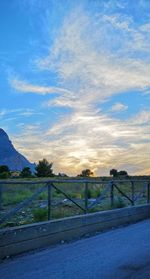 Scenic view of landscape against blue sky