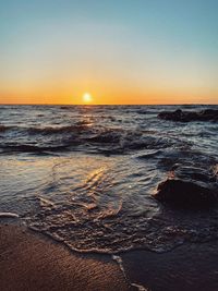 Scenic view of sea against sky during sunset