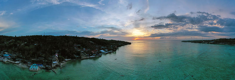 Panoramic view of sea against sky during sunset