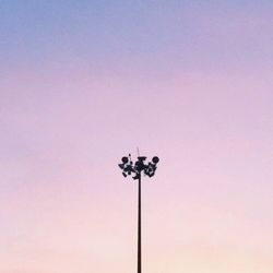 Low angle view of street light against sky