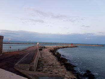 Pier over sea against sky