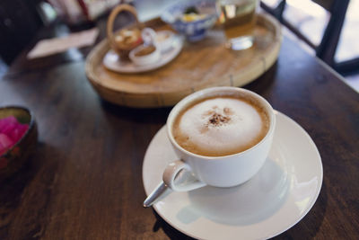 High angle view of coffee cup on table