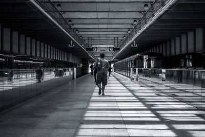 Full length of woman standing on footbridge