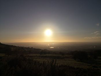 Scenic view of landscape against sky during sunset