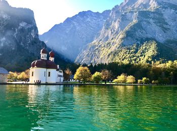 Scenic view of lake and mountains against sky