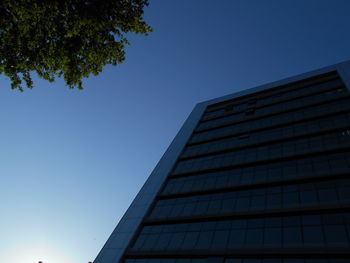 Low angle view of modern building against clear sky