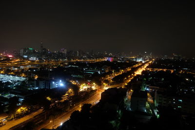 High angle view of illuminated city buildings at night