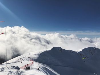 Scenic view of snow covered mountains against sky