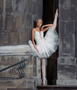 Woman standing against wall