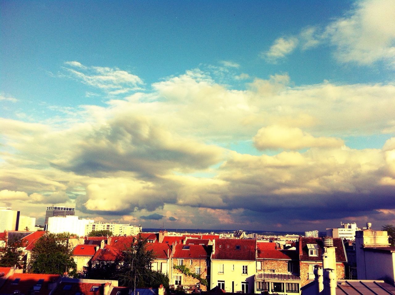 building exterior, architecture, built structure, sky, cloud - sky, residential structure, residential building, residential district, cloudy, city, house, cityscape, weather, town, crowded, cloud, townscape, high angle view, overcast, storm cloud