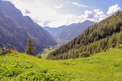 Scenic view of landscape and mountains against sky