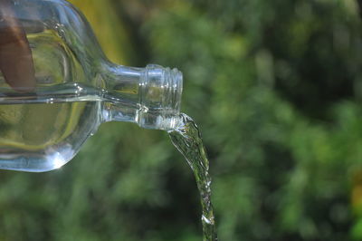 Close-up of water drops on glass bottle