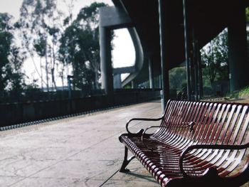 Empty seat against trees