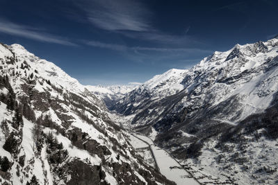 Scenic view of snowcapped mountains against sky