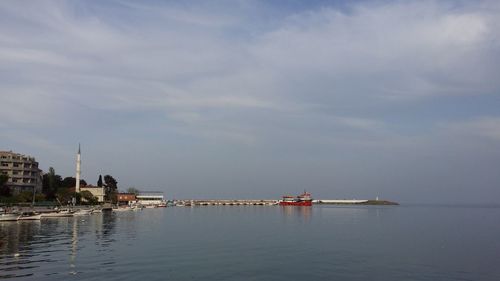 View of ship in sea against cloudy sky