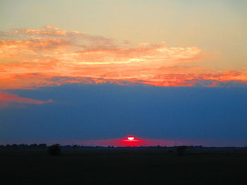 Scenic view of silhouette landscape against sky during sunset