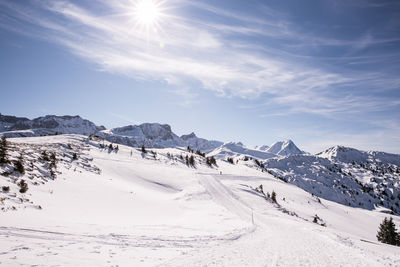 Scenic view of snow covered mountains against sky