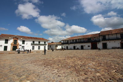 View of buildings against cloudy sky