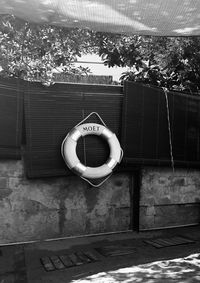 Electric lamp hanging on wall