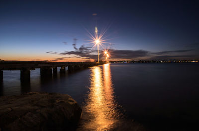 Scenic view of illuminated sky at night