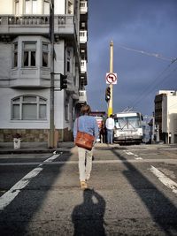 Person photographing man from back