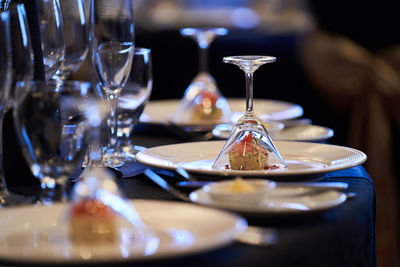 Close-up of wine glasses on table in restaurant