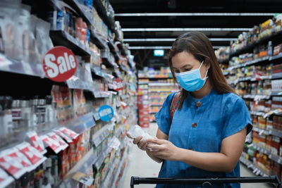 Woman standing on a store