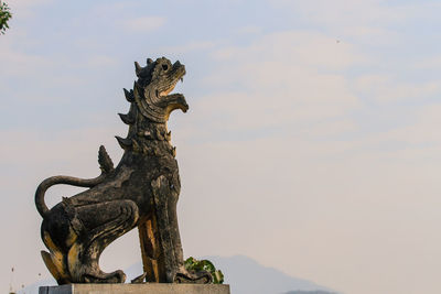 Close-up of statue against sky