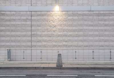 View of street light on wall at street