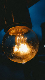 Low angle view of illuminated light bulb