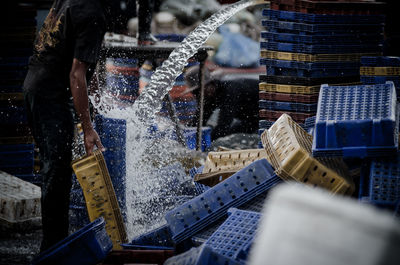 Fisherman washing baskets