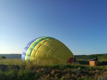 Hot air ballon in field