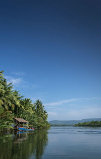 Scenic view of sea against blue sky