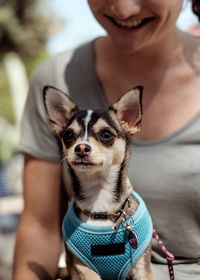 Portrait of woman holding dog